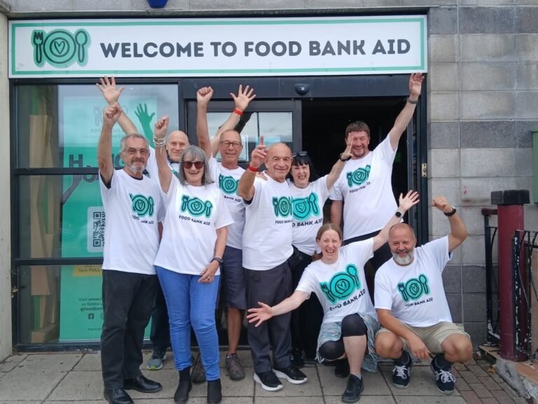 Food bank aid team celebrating outside gnlp