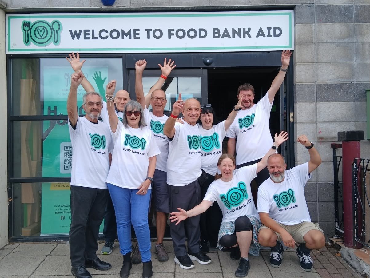 Food bank aid team celebrating outside gnlp